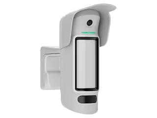 30400306 Wall-mounted security motion detector with a lens and indicator light.