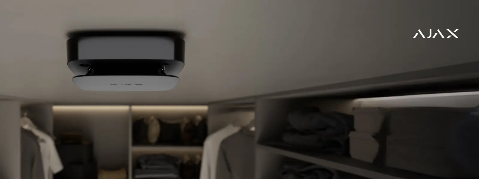Modern square ceiling light fixture mounted in a walk-in closet.